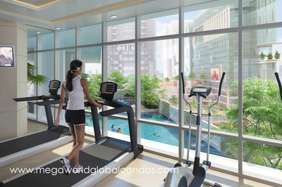 Uptown Ritz Fort Bonifacio condos - Fitness Center / Gym Amenity overlooking the swimming pool and Uptown Place Mall